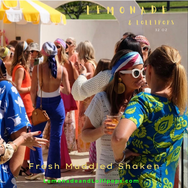Crowd in resort wear under a yellow striped canopy holding 32 oz lemonades